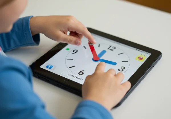 Student using "Lock Hands" on interactive clock.